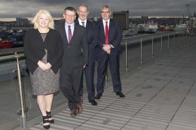 Waterloo Quay Properties managing director Anna-Marie Eardley with, from left, Alan Smith, Jim Grimmer and Bill Beattie of Matrix Risk Control. Picture: Contributed