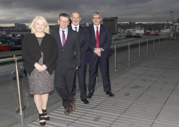Waterloo Quay Properties managing director Anna-Marie Eardley with, from left, Alan Smith, Jim Grimmer and Bill Beattie of Matrix Risk Control. Picture: Contributed
