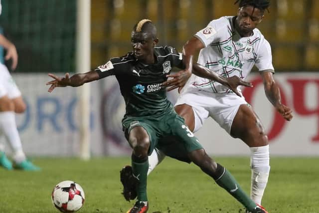 Kouassi Eboue, left, battles with Alex Song during a Russian Premier League match. Picture: Getty
