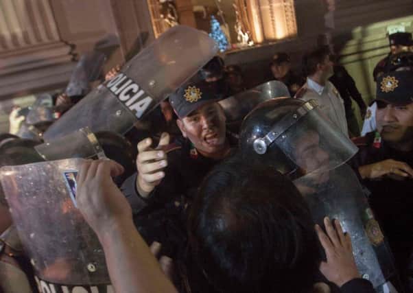 Police confront protesters in the city of Monterrey in Mexico. Picture: AFP/Getty Images