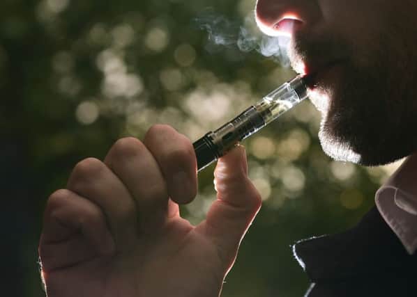 E-cigarettes have a fraction of the harmful chemicals of cigarettes but concerns remain they could glamourise smoking. Picture: Yui Mok/PA Wire