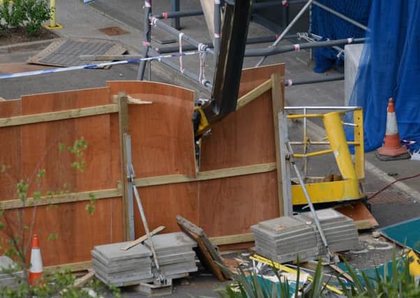 One man died and a second suffered serious injuries when a crane boom collapsed. Picture: SWNS