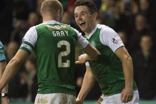 John McGinn celebrates scoring Hibs' third goal with captain David Gray. Picture: Craig Foy/SNS