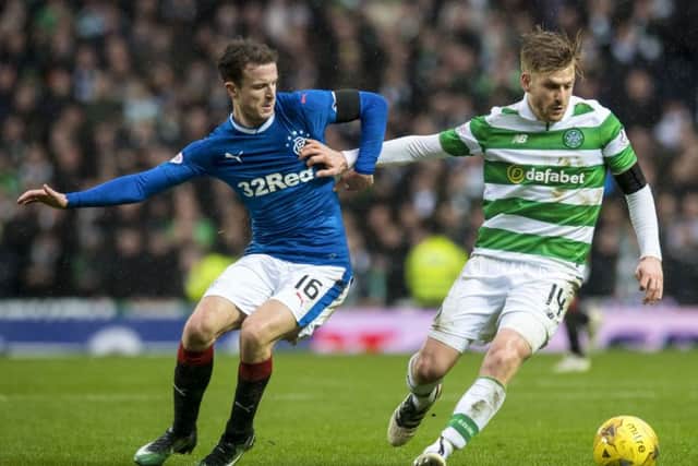 Stuart Armstrong shields the ball from Rangers' Andy Halliday during Celtic's 2-1 win at Ibrox on Hogmanay. Picture: Craig Williamson/SNS