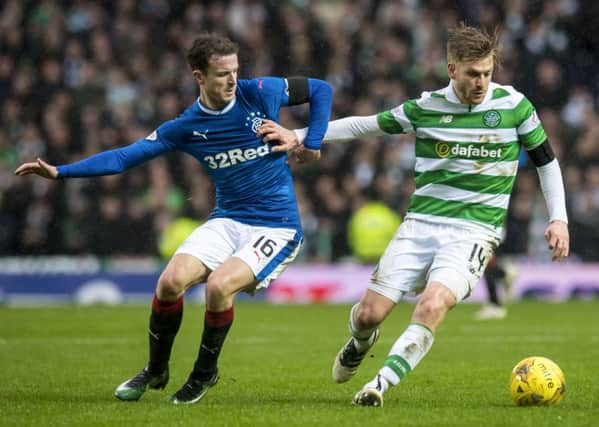 Stuart Armstrong shields the ball from Rangers' Andy Halliday during Celtic's 2-1 win at Ibrox on Hogmanay. Picture: Craig Williamson/SNS