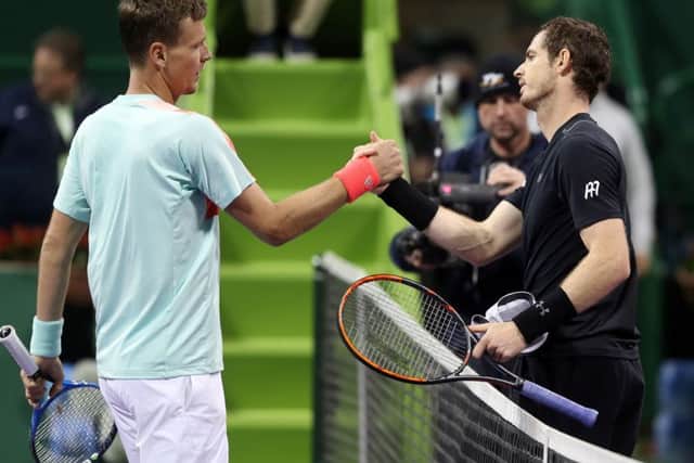 Andy Murray, right, greets Czech Republics Tomas Berdych at the net following their semi-final  at the ATP Qatar Open in Doha. Picture: Karim Jafaar/AFP/Getty