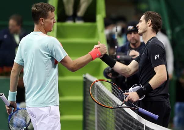 Andy Murray, right, greets Czech Republics Tomas Berdych at the net following their semi-final  at the ATP Qatar Open in Doha. Picture: Karim Jafaar/AFP/Getty