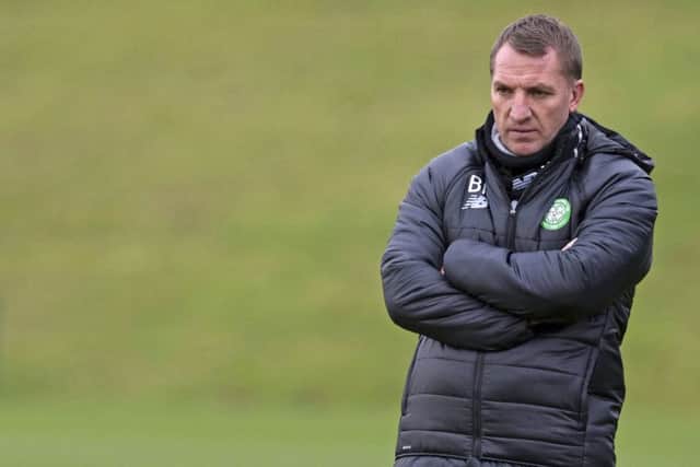 Brendan Rodgers may ditch the warm coat in Dubai but he wont ditch the hard-driving coaching that has taken Celtic to new heights. Picture: SNS