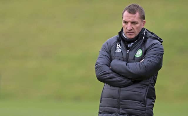Brendan Rodgers may ditch the warm coat in Dubai but he wont ditch the hard-driving coaching that has taken Celtic to new heights. Picture: SNS