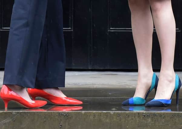 Theresa May and Nicola Sturgeon bring Britain to heel. Photograph: Lesley Martin/Getty