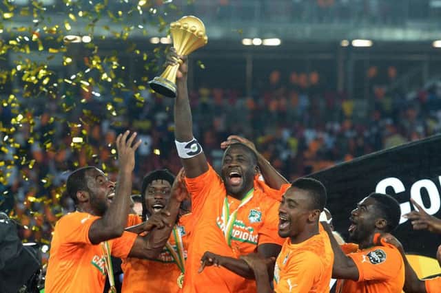 Cote dIvoires Yaya Toure raises the trophy in 2015. Picture: Khaled Desouki/Getty Images