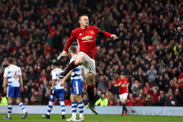 Wayne Rooney celebrates scoring Manchester Uniteds opening goal against Reading and equalling Sir Bobby Charltons all-time record.  Picture: Martin Rickett/PA