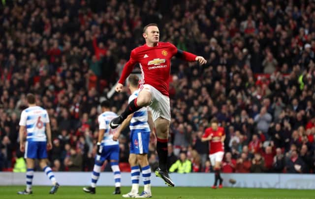 Wayne Rooney celebrates scoring Manchester Uniteds opening goal against Reading and equalling Sir Bobby Charltons all-time record.  Picture: Martin Rickett/PA