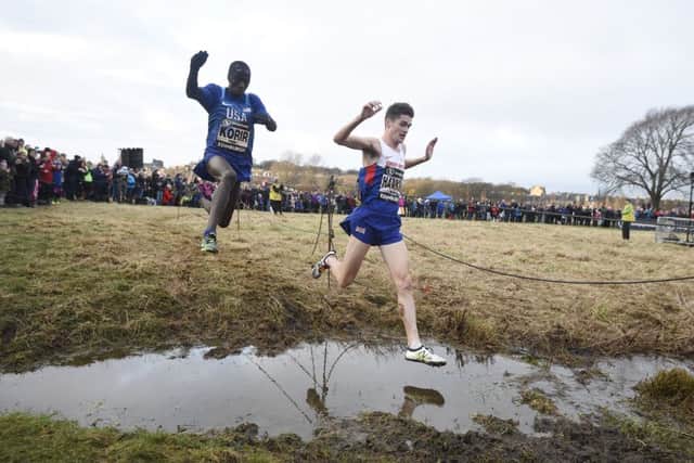 Callum Hawkins leaps some water ahead of American Leonrad Korir, who overtook the Scot just yards from the finish line.
Photograph: Greg Macvean