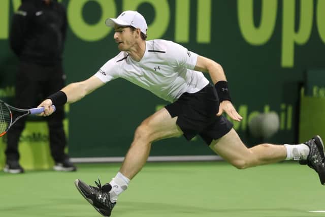 Andy Murray stretches for the ball during his three-set final defeat in Doha. Picture: Getty Images