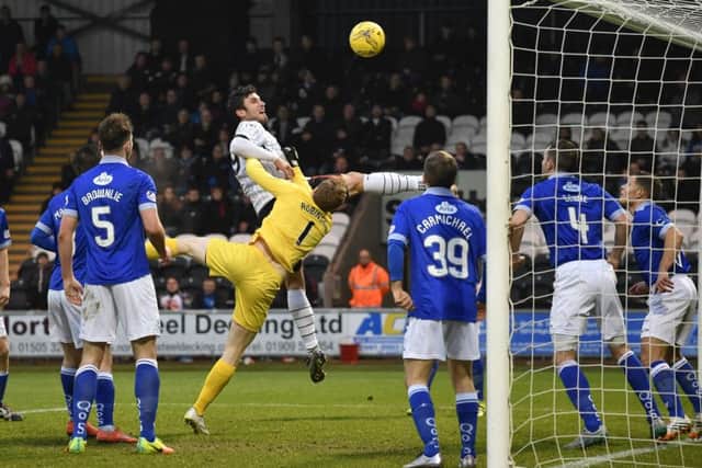 St Mirren's John Sutton comes close with a header for the home side during Saturday's 3-0 defeat by Queen of the South. Picture: SNS