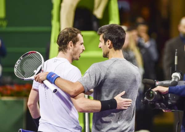 Novak Djokovic, right, embraces Sir Andy Murray after beating him in the Qatar Open final in Doha. Picture: AP Photo/Alexandra Panagiotidou