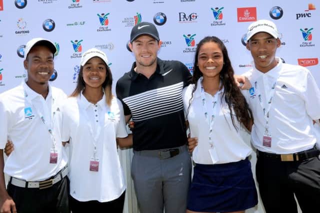 Rory McIlroy poses with players of The Ernie Els and Fancourt Foundation after they had taken part in the Friendship Cup with The Faldo Junior Series Team during the pro-am for the 2017 BMW South African Open Championship. Picture: David Cannon/Getty Images