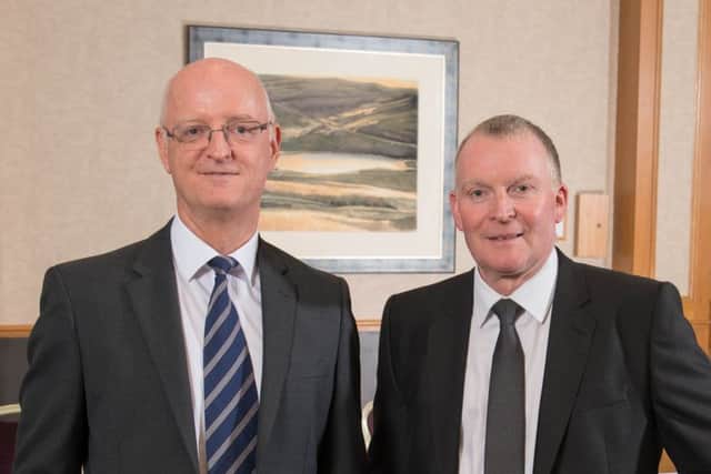DM Hall managing partner Eric Curran, left, with newly elected senior partner John Albiston. Picture: Contributed