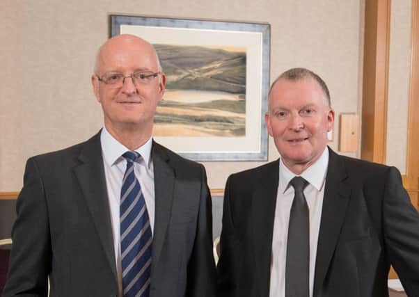 DM Hall managing partner Eric Curran, left, with newly elected senior partner John Albiston. Picture: Contributed