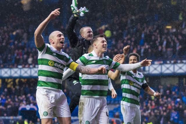Unstoppable? Celtic skipper Scott Brown leads the celebrations after the 2-1 victory over Rangers on Hogmanay. Celtic must remain unbeaten for three more games to break the record set by the Lisbon Lions.