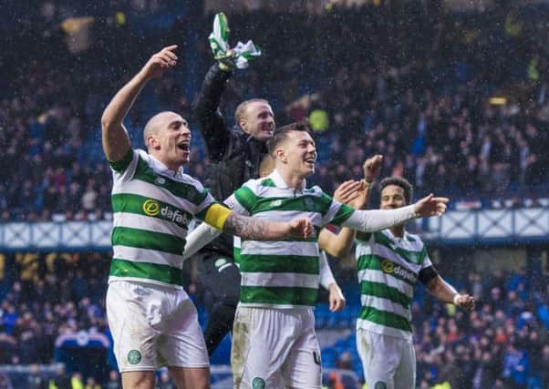 Unstoppable? Celtic skipper Scott Brown leads the celebrations after the 2-1 victory over Rangers on Hogmanay. Celtic must remain unbeaten for three more games to break the record set by the Lisbon Lions.