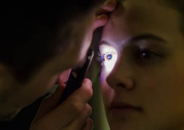 The Arclight in use, a pocket-sized device that has been created which could help save the sight of millions. Picture: PA