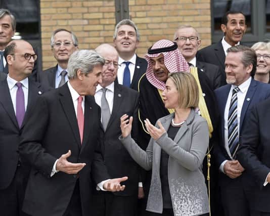 US Secretary of State John Kerry speaks with European Union Foreign Policy Chief Federica Mogherini. Picture; PA