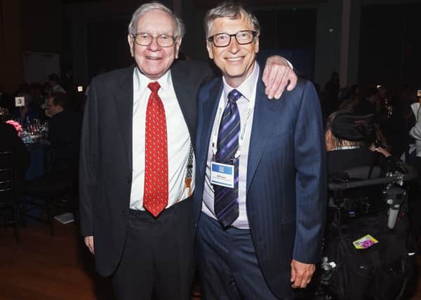 Warren Buffett (L) and Bill Gates attend the Forbes' 2015 Philanthropy Summit Awards Dinner. Picture; getty