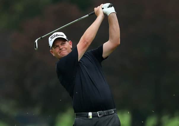 Scotland's David Drysdale hits his second shot on the 16th hole during day two of The BMW South African Open. Picture: Warren Little/Getty Images