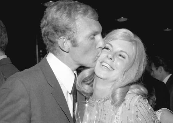 Celebration time: England captain Bobby Moore and his first wife Tina at a reception following their World Cup victory in July 1966.  Picture: Reg Burkett/Getty Images