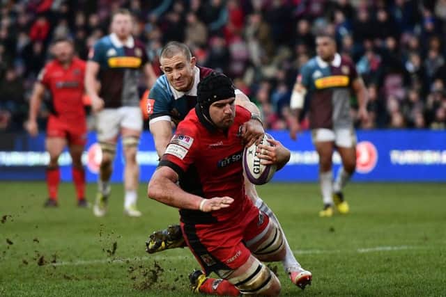 Edinburghs Fraser McKenzie evades full-back Mike Browns despairing tackle to dive over to score his sides first try. Picture: Dan Mullan/Getty Images