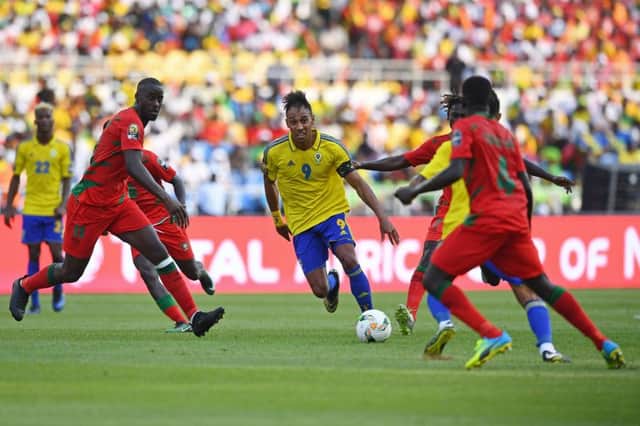 Gabon forward Pierre-Emerick Aubameyang, centre, tries to find a way through. Picture: Gabriel Bouys/Getty Images