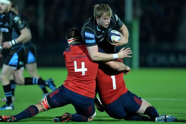 No way through for Jonny Gray of Glasgow as he is tackled by Munster's Jean Kleyn and Dave Kilcoyne. Picture: Mark Runnacles/Getty Images