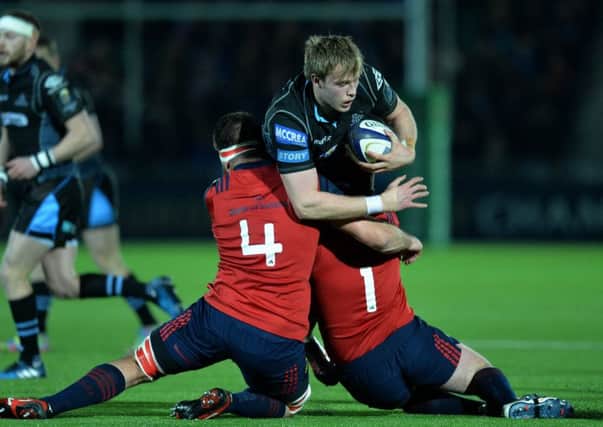 No way through for Jonny Gray of Glasgow as he is tackled by Munster's Jean Kleyn and Dave Kilcoyne. Picture: Mark Runnacles/Getty Images