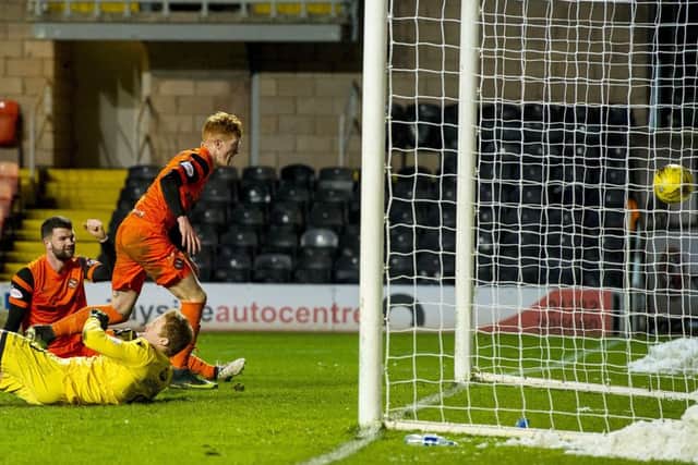 Dundee Uniteds Simon Murray scores a late equaliser to make it 3-3 and salvage a point. Picture: SNS.