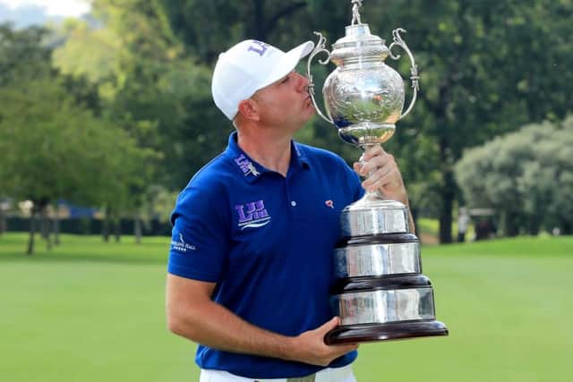 Graeme Storm kisses the South African Open trophy. Picture: Getty.