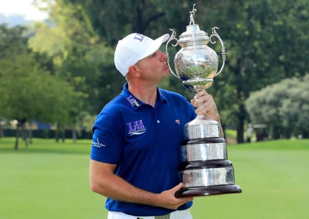 Graeme Storm kisses the South African Open trophy. Picture: Getty.