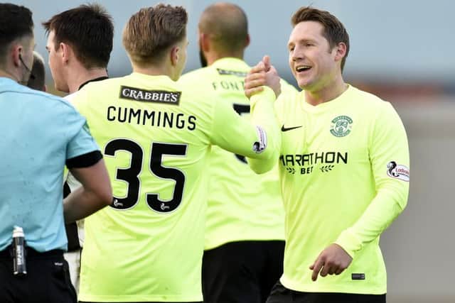 Kris Commons celebrates the winning goal with Jason Cummings. Picture: SNS