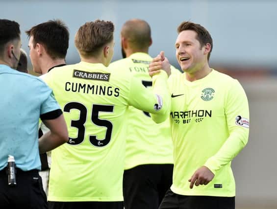 Kris Commons celebrates the winning goal with Jason Cummings. Picture: SNS