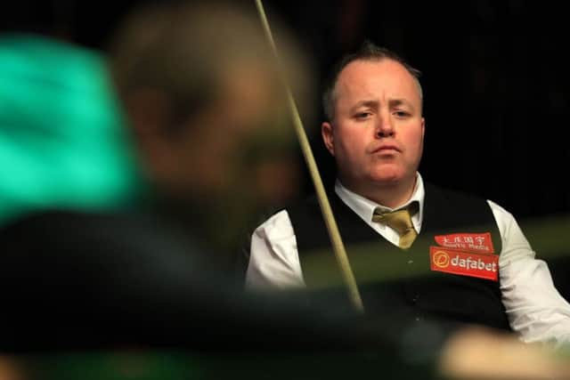 Scotland's John Higgins watches from his chair as Mark Allen plays a shot at the Dafabet Masters at Alexandra Palace, London. Picture: Adam Davy/PA Wire