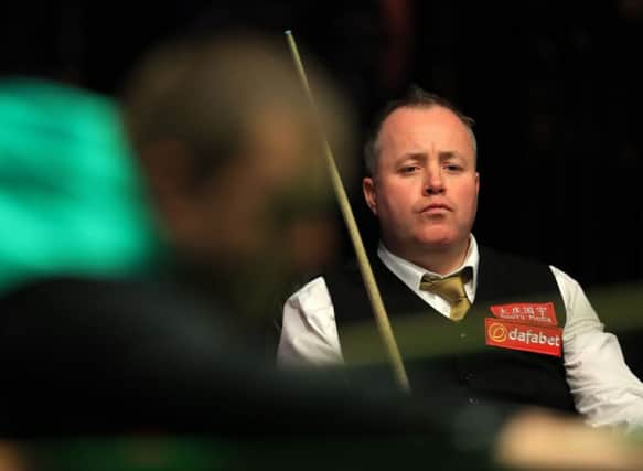 Scotland's John Higgins watches from his chair as Mark Allen plays a shot at the Dafabet Masters at Alexandra Palace, London. Picture: Adam Davy/PA Wire