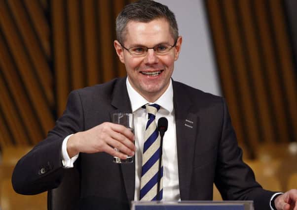 Derek Mackay insisted that the overall council funding is up. Picture: Andrew Cowan/Scottish Parliament