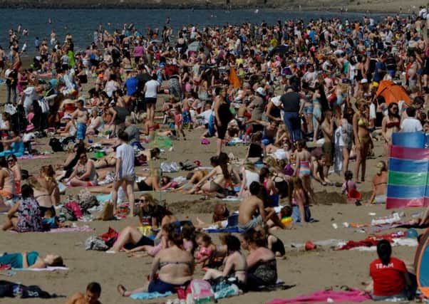 Sun-lovers basked in 24C heat on Ayr beach in 2016, the hottest year on record globally. Picture: SWNS
