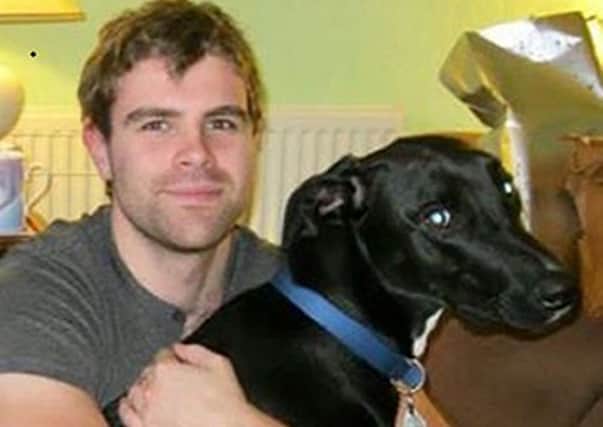 Cameron Logan, 23, with his dog Gomez. Picture: Police Scotland/PA Wire