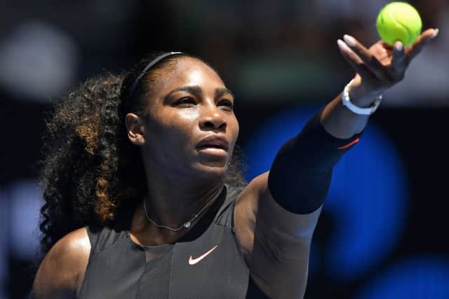 Serena Williams prepares to serve during her victory over Switzerland's Belinda Bencic in the first round match of the Australian Open. Picture: Andy Brownbill/AP