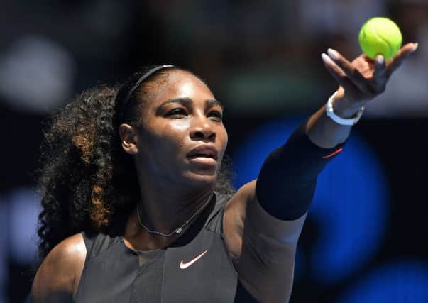 Serena Williams prepares to serve during her victory over Switzerland's Belinda Bencic in the first round match of the Australian Open. Picture: Andy Brownbill/AP