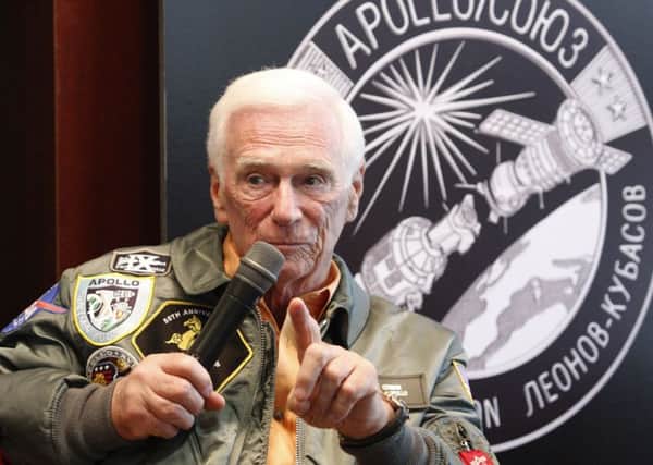 OKLAHOMA CITY, OK - MAY 27: Gene Cernan speaks at a presentation of a lunar rover, Apollo 10 space suit and Mars rover along with Speedmaster mission watches from Gemini and Apollo missions for the Oklahoma City community to celebrate this historic milestone in space exploration presented by OMEGA and B.C. Clark at B.C. Clark Penn Square Mall on May 27, 2010 in Oklahoma City, Oklahoma. (Photo by Brett Deering/Getty Images for OMEGA)