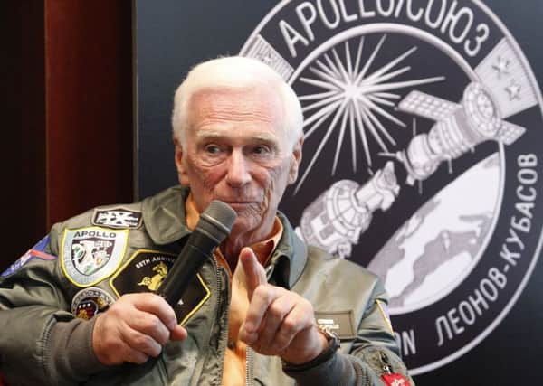 OKLAHOMA CITY, OK - MAY 27: Gene Cernan speaks at a presentation of a lunar rover, Apollo 10 space suit and Mars rover along with Speedmaster mission watches from Gemini and Apollo missions for the Oklahoma City community to celebrate this historic milestone in space exploration presented by OMEGA and B.C. Clark at B.C. Clark Penn Square Mall on May 27, 2010 in Oklahoma City, Oklahoma.   (Photo by Brett Deering/Getty Images for OMEGA)