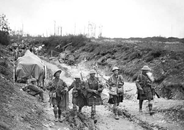 A piper of the 7th Seaforth Highlanders leads four men of the 26th Brigade after the attack on Longueval in 1916. Photograph: Lt. J W Brooke/ IWM via Getty Images